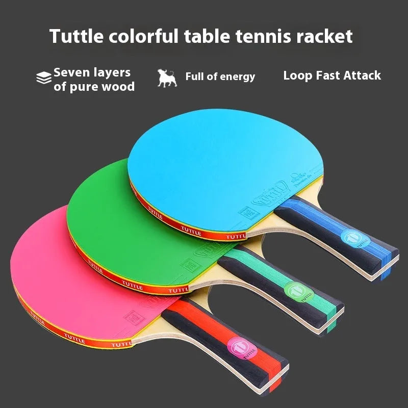 Blue, green, and pink shakehand grip table tennis rackets with matching racket covers laid out.
