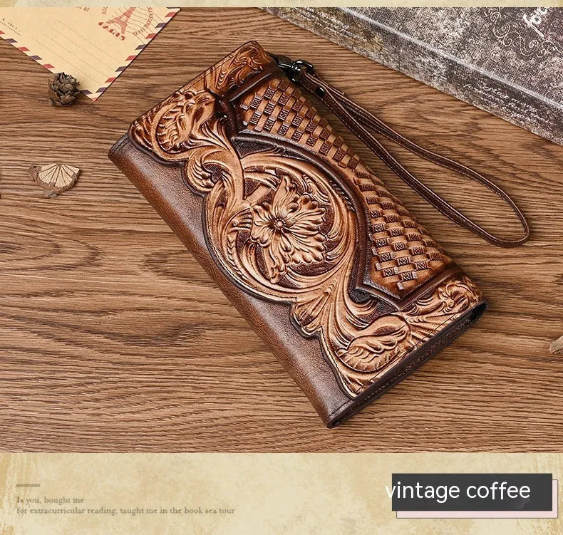 Women's brown cowhide tri-fold wallet with embossed floral pattern showing open compartments