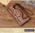 Women's brown cowhide tri-fold wallet with embossed floral pattern showing open compartments
