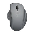 Black and grey wireless computer mouse with USB charger on white background