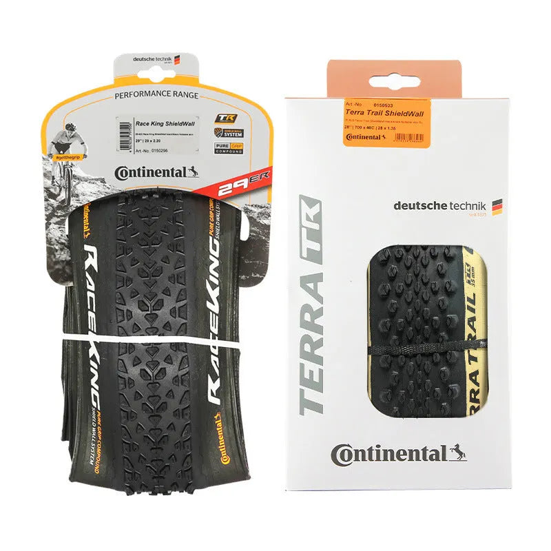 A folding mountain bike tyre in yellow or white, showing tread pattern, available in 26, 27.5 and 29 inch sizes.
