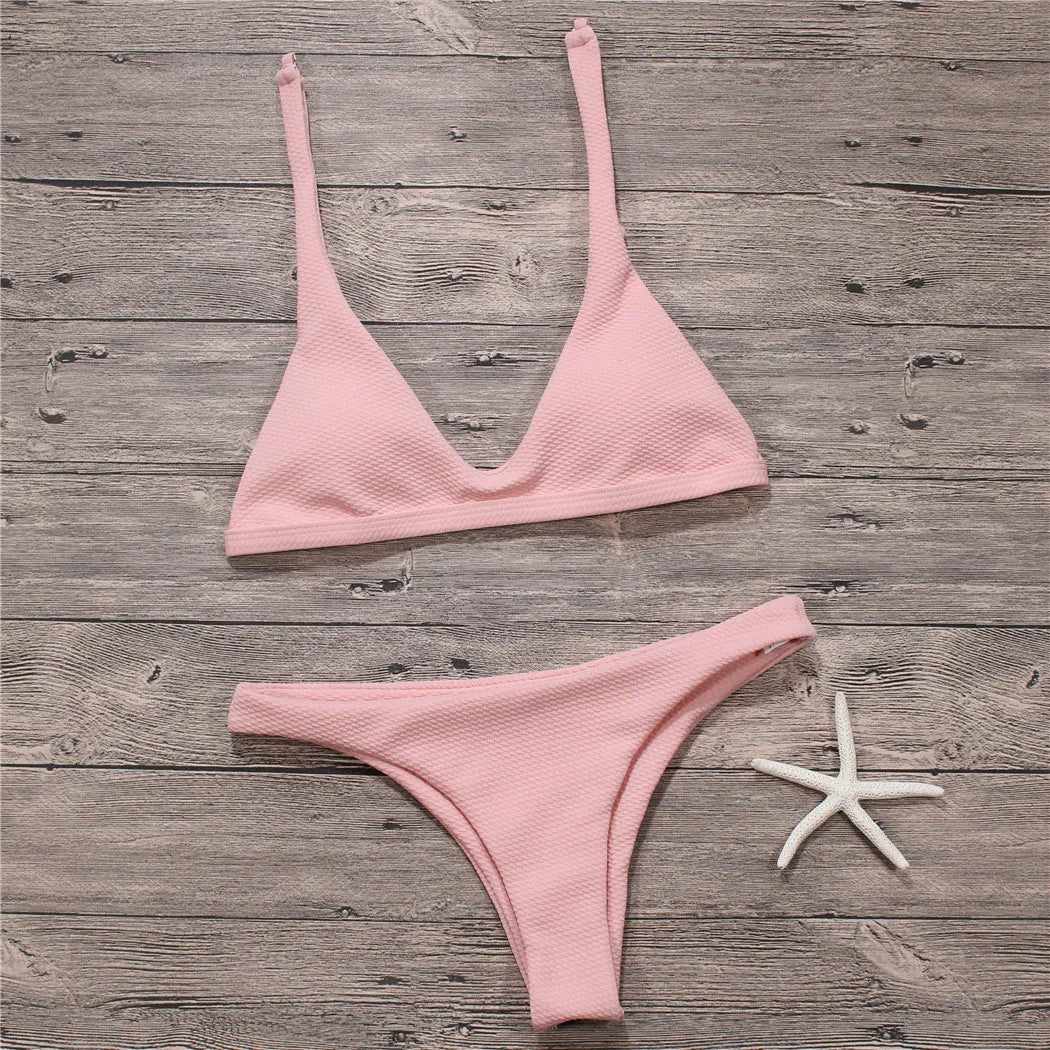 Women's solid low waist bikini set in black with padded wire-free top and stretch fabric