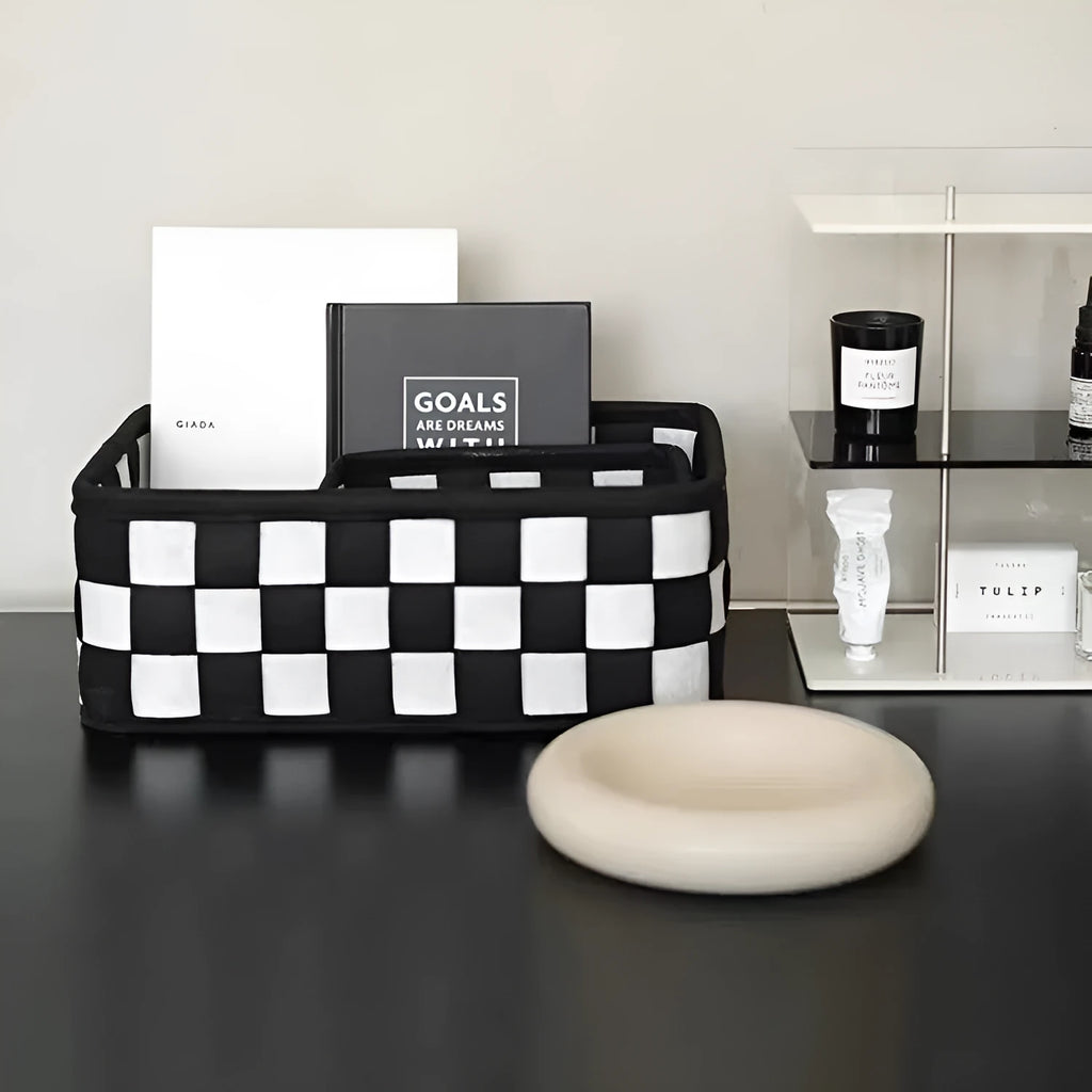 Checkerboard patterned folding felt storage basket showing collapsible sides.