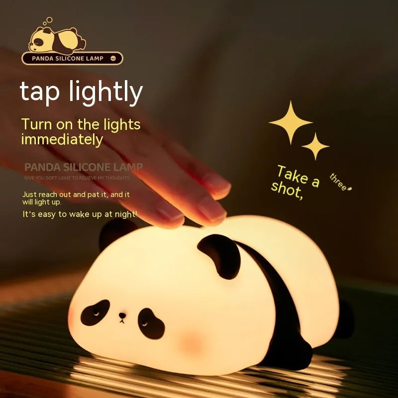 Cartoon panda night light with black and white silicone design on bedside table
