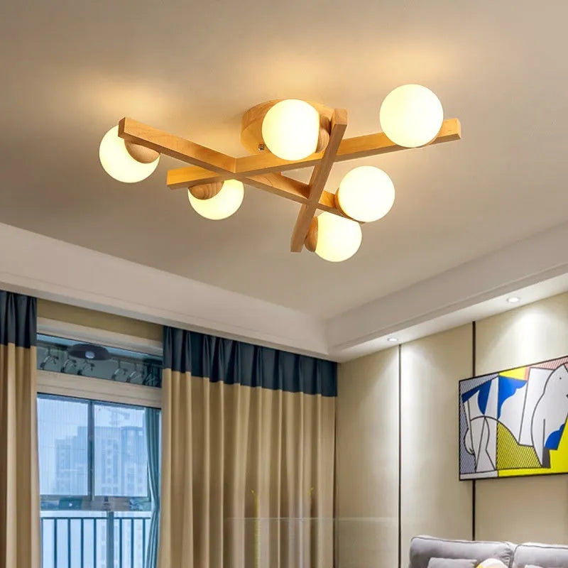Modern wooden-style Nordic ceiling light fixture with three adjustable heads.