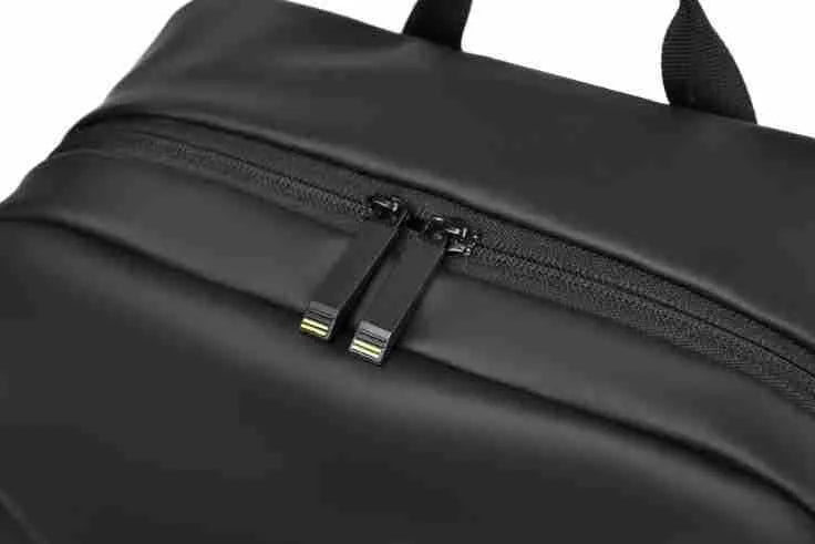 Large black waterproof PU leather backpack for men with simple design and sewing thread details.
