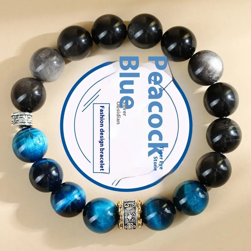 Handmade geometric Peacock Blue Tigereye stone bracelet with round beads on a wrist.