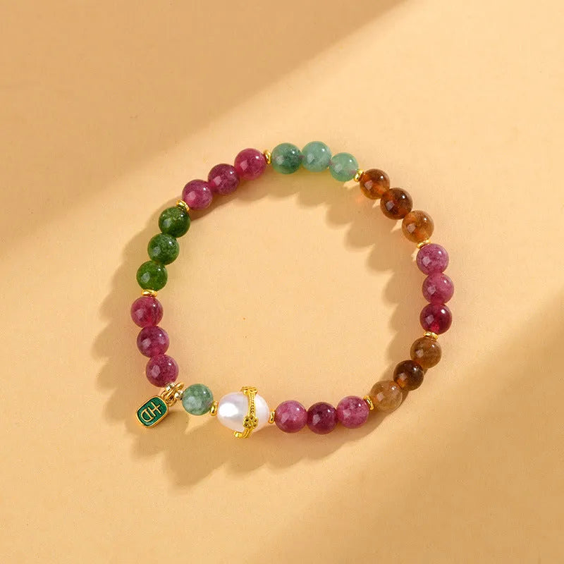 Geometric chalcedony bracelet with 6.5mm beads and natural crystal construction