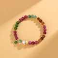 Geometric chalcedony bracelet with 6.5mm beads and natural crystal construction