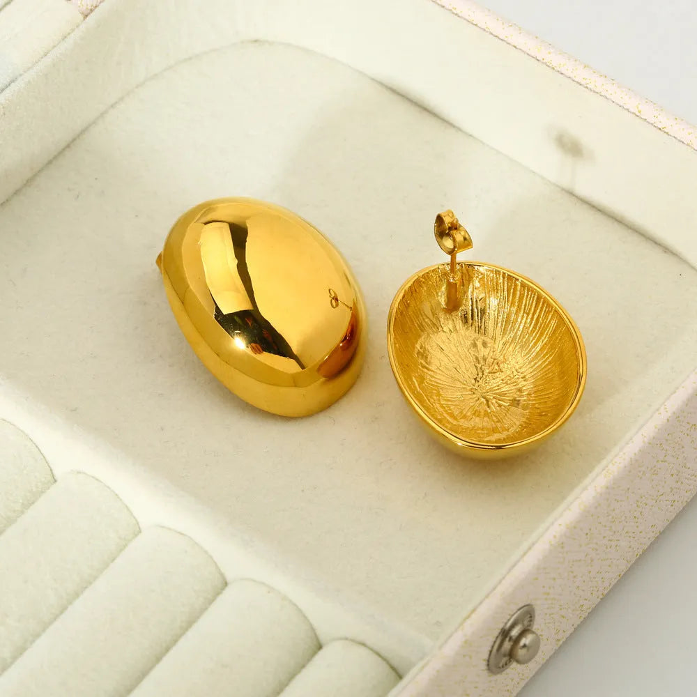 Geometric stainless steel earrings with glazed surface and line elements in gold colour DFE139