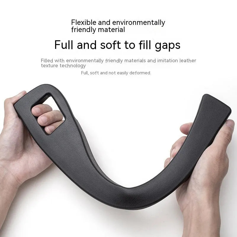 Black car seat gap storage box organiser with handle placed between vehicle seats