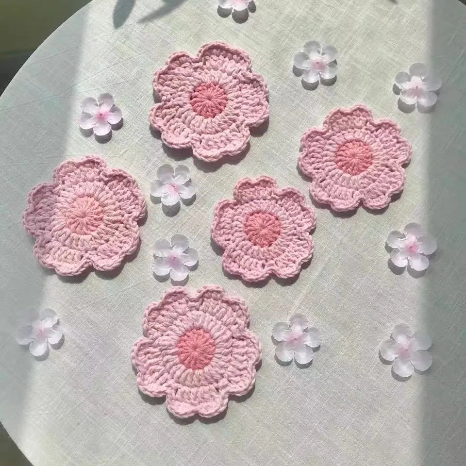 Circular handwoven wool coaster on a wooden table