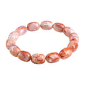 Natural cherry agate bracelet with 10x14mm barrel beads and Ruyi geometric elements