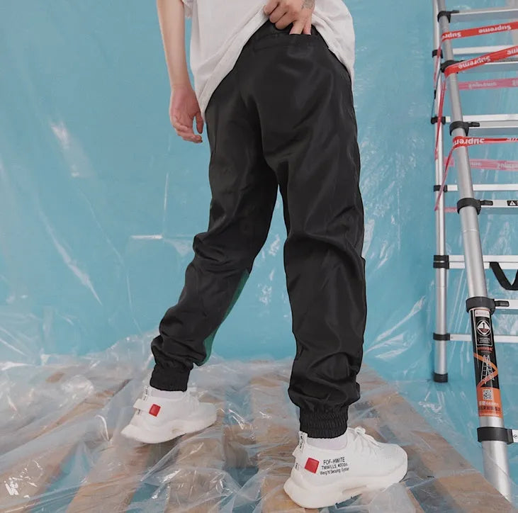 Japanese hip hop trousers with hit colour stitching, letter print, and bouquet foot detail in green low-waist drawstring style