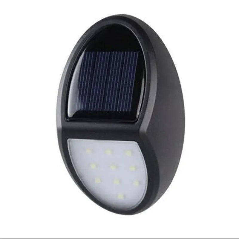 Black solar-powered LED wall light with automatic sensor for outdoor garden or patio illumination