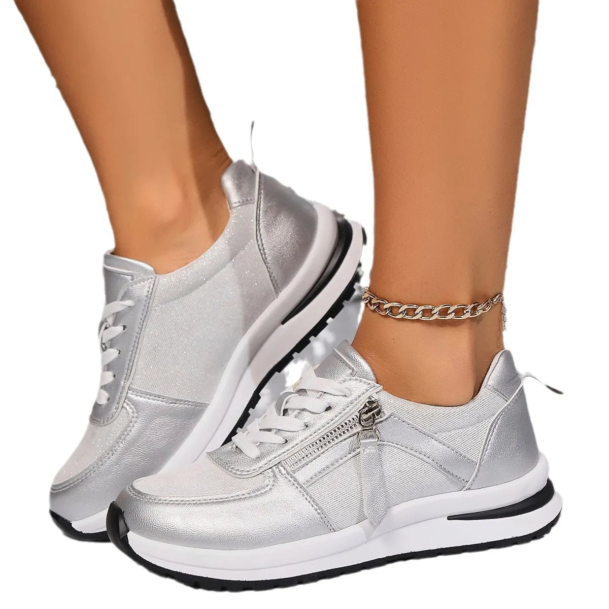 Gold women's lace-up pumps with round toe and flat rubber sole on a white background.
