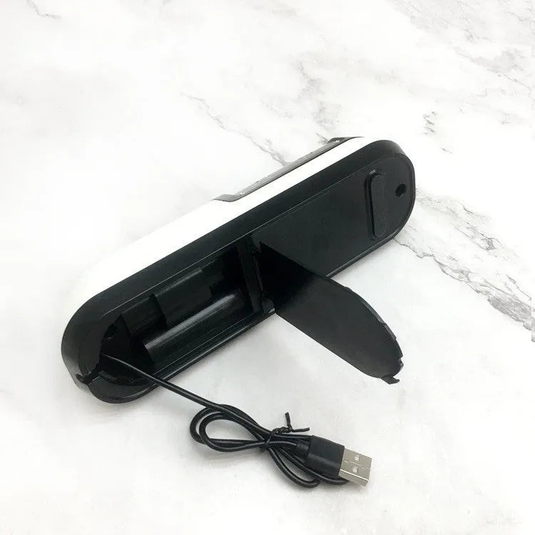 Rechargeable electric knife sharpener with ABS body and stainless steel components on a kitchen counter