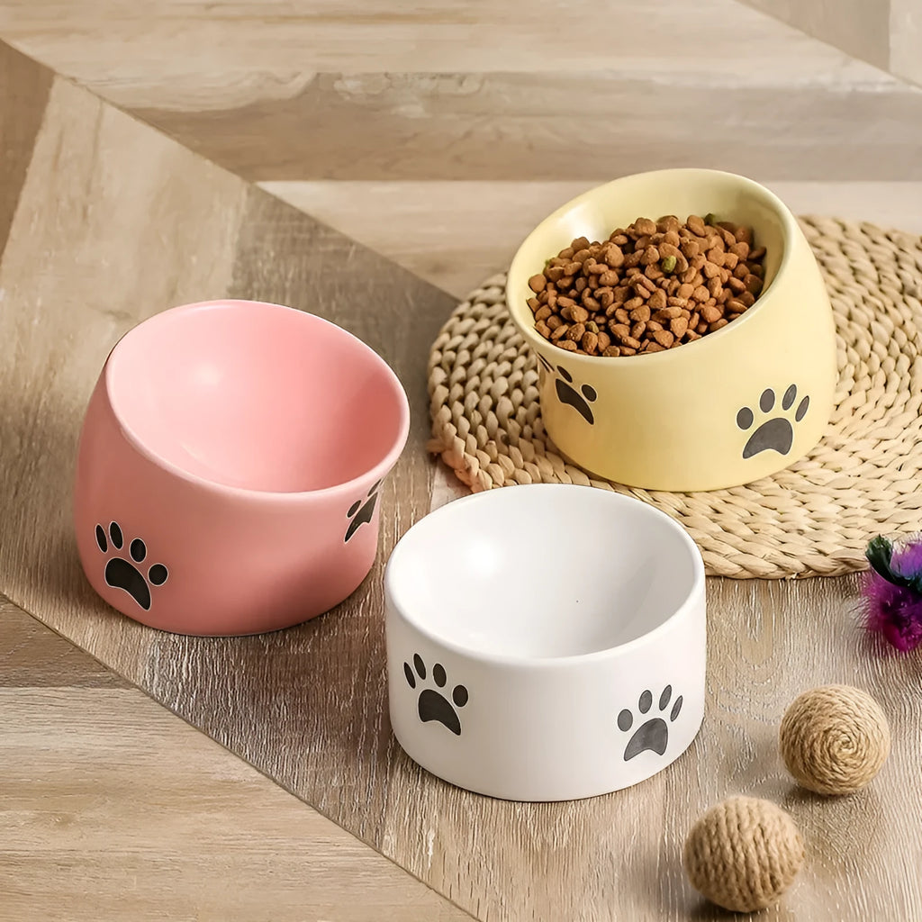 Ceramic cat paw design pet bowl with high-foot base in slanted mouth style