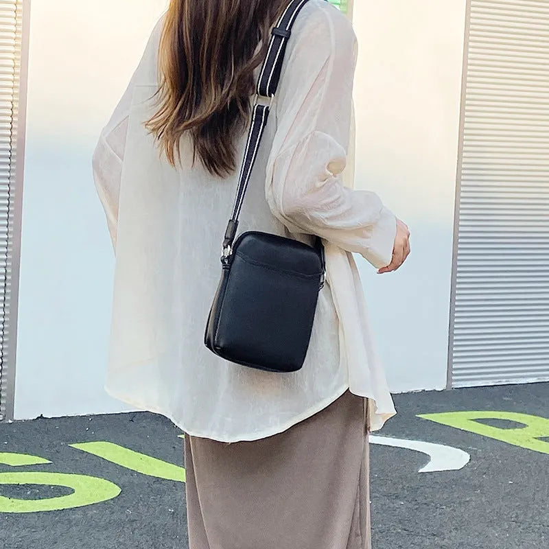 Solid colour mobile phone crossbody shoulder bag in PU material showing front view