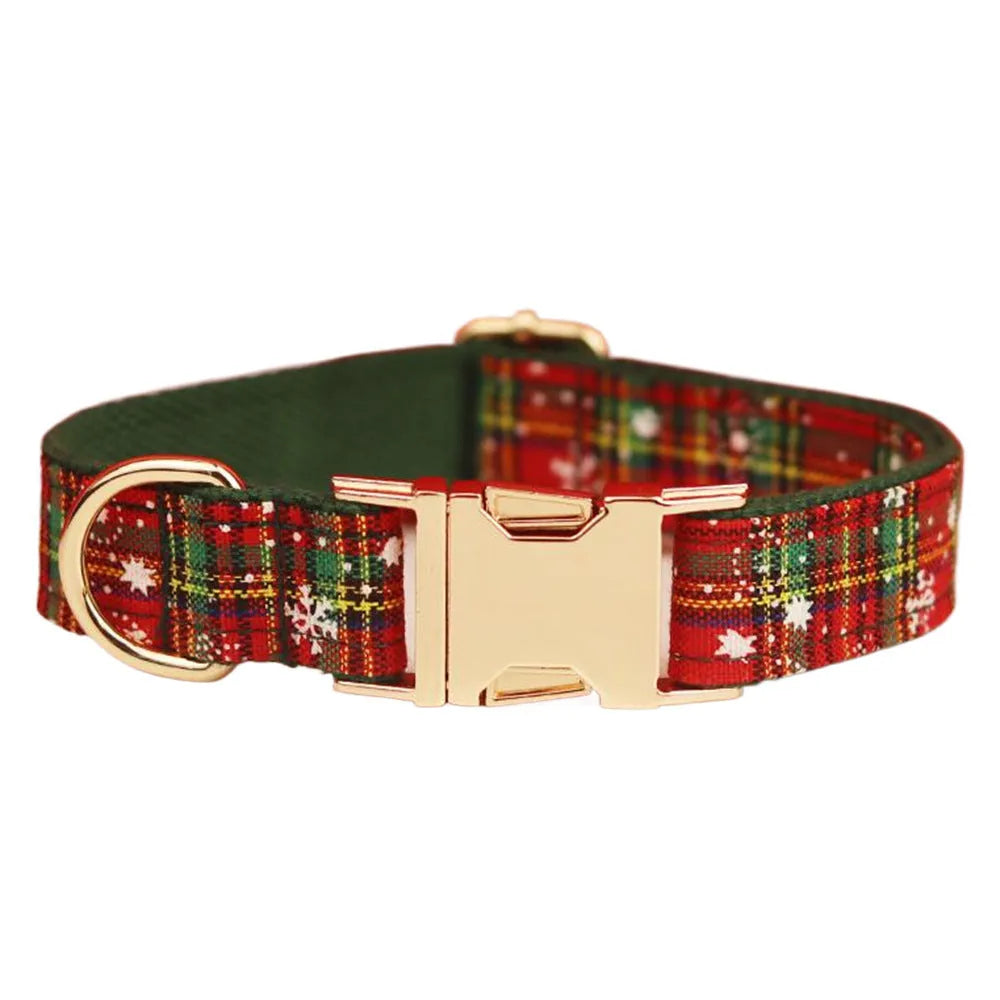 Green snowflake print dog collar set with matching leash, vest, and bow for Christmas