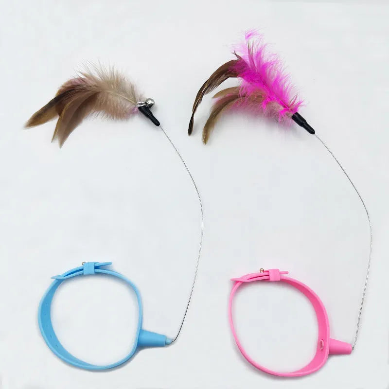 Adjustable collar cat teaser toy with feather and bell attachment in blue or pink colour options