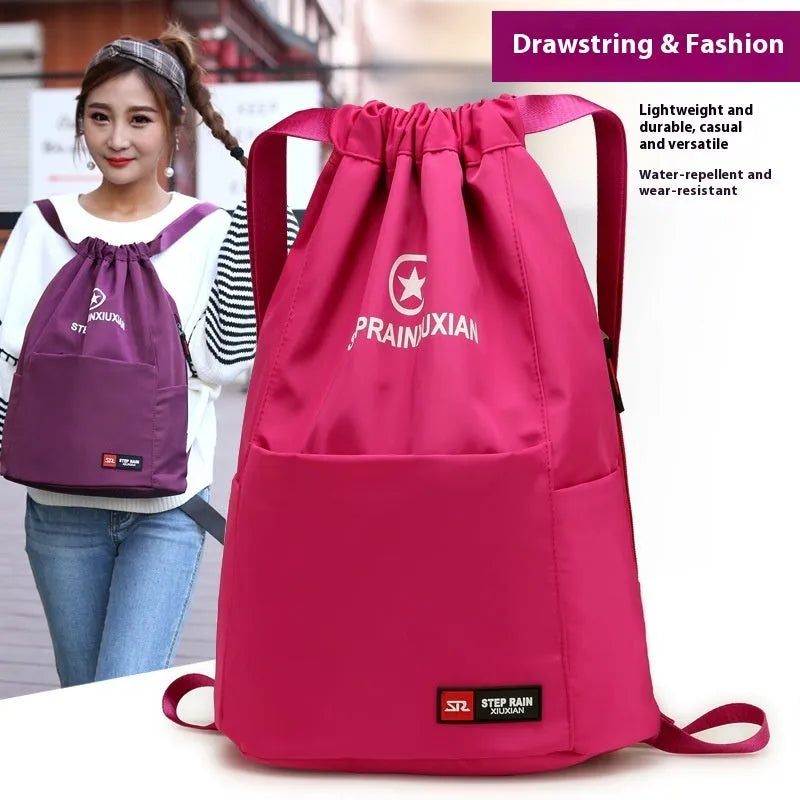 Solid colour drawstring backpack in Oxford cloth with double straps and a water pillow belt.