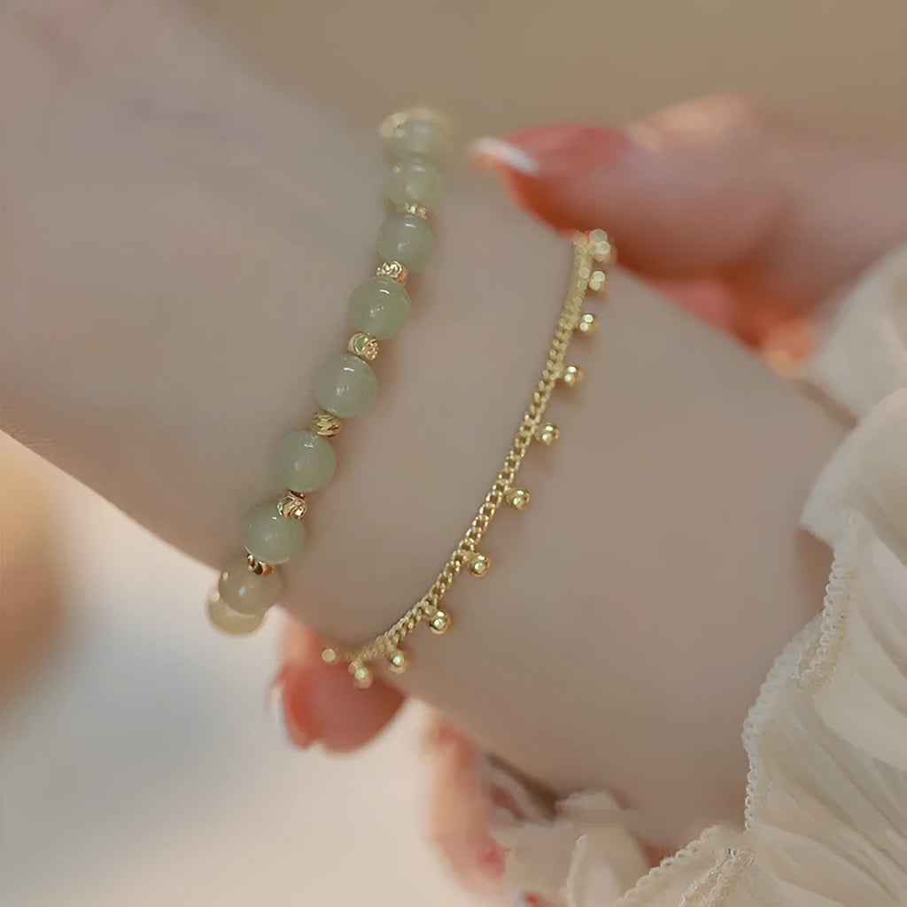 Handcrafted natural Hetian jade bracelet showing bead and charm style variations
