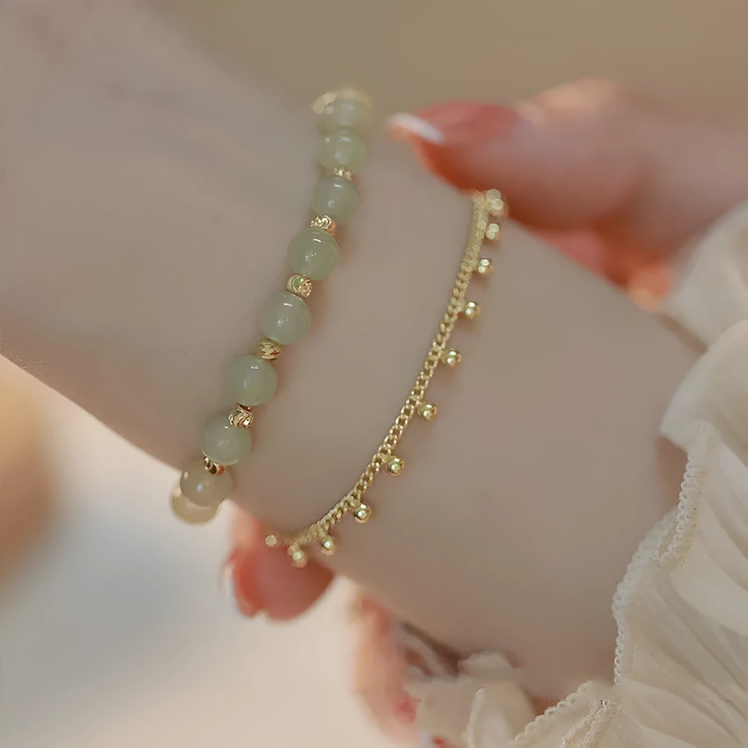 Handcrafted natural Hetian jade bracelet showing bead and charm style variations