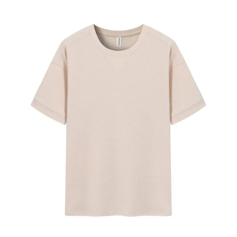 Men's dark grey waffle-knit short sleeve T-shirt showing textured fabric detail.