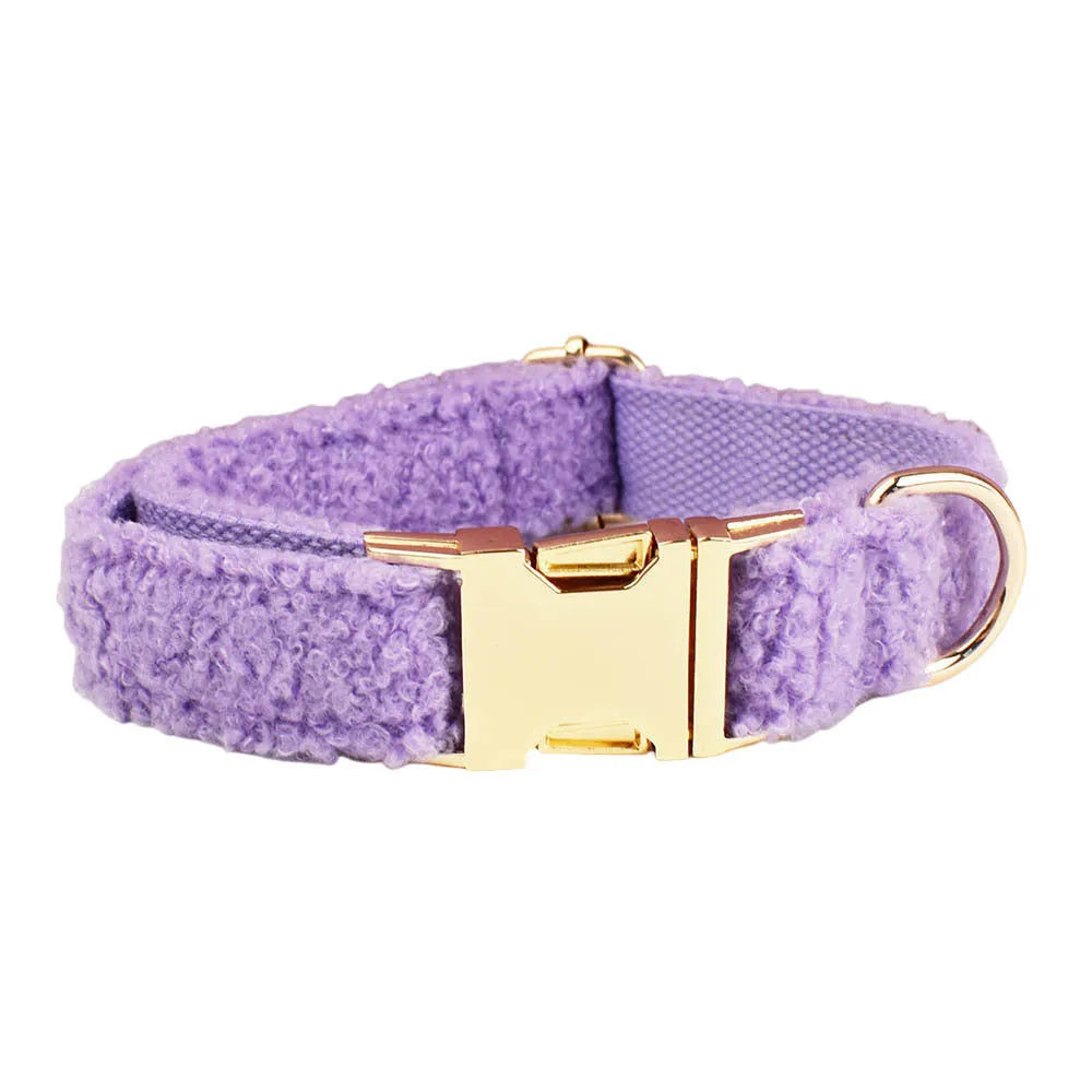 Purple cloth dog collar, leash, vest and bow four-piece pet accessory set showing coordinated design