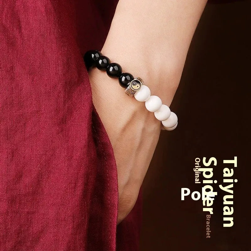 Black and white obsidian bodhi seed taiji bracelet with geometric beads and mantra engraving