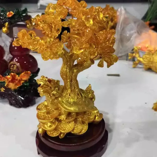 Resin Feng Shui ornament of a citrine small water turtle money tree, Chinese style.