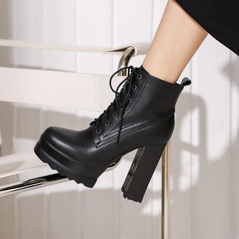 Women's black chunky heel waterproof ankle boots with a side zipper and round toe.