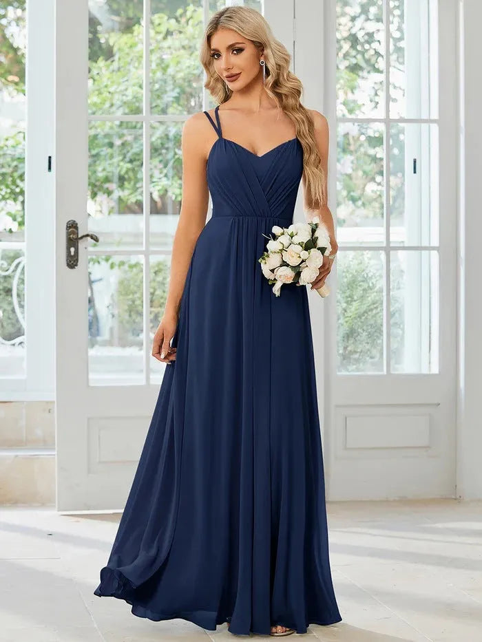 Women's sleeveless long pleated dress in an A-line silhouette, shown in a solid colour.
