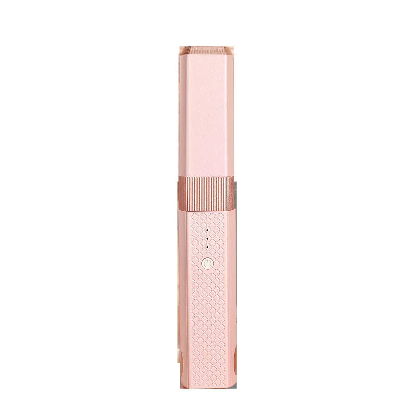 Pink cordless USB hair straightener with ceramic plates on a white background.