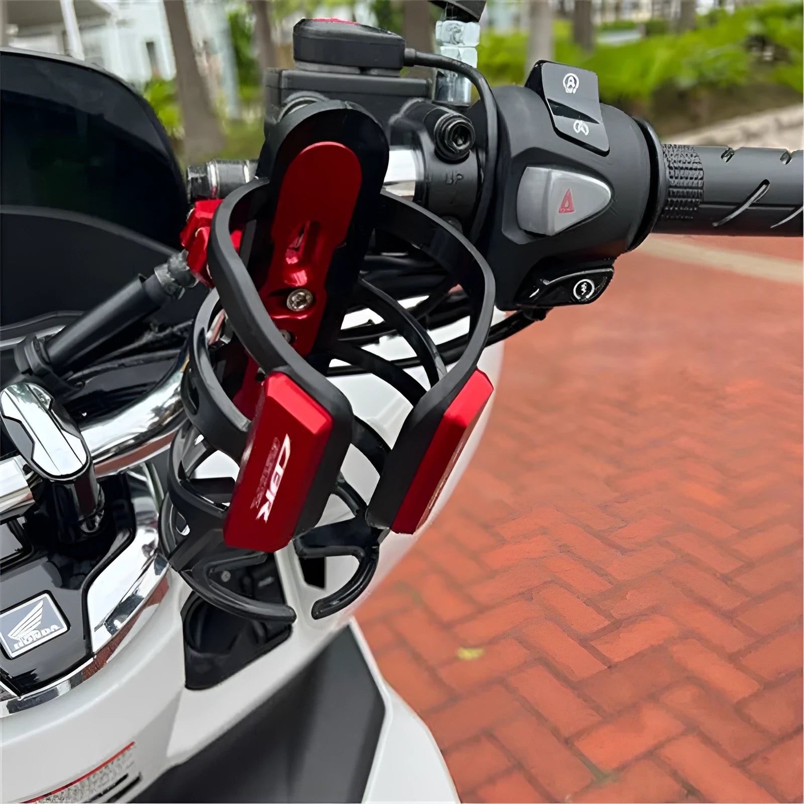 Modified water bottle cage for Honda X-ADV750 and XADV150 scooters in multiple colours
