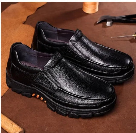 Black and brown business casual slip-on leather shoes with a rubber sole.