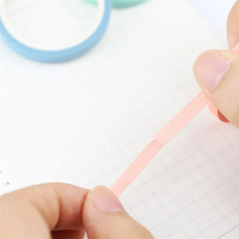 Roll of solid colour paper tape in crimson or deep purple, showing 5mm width stationery tape for organisation