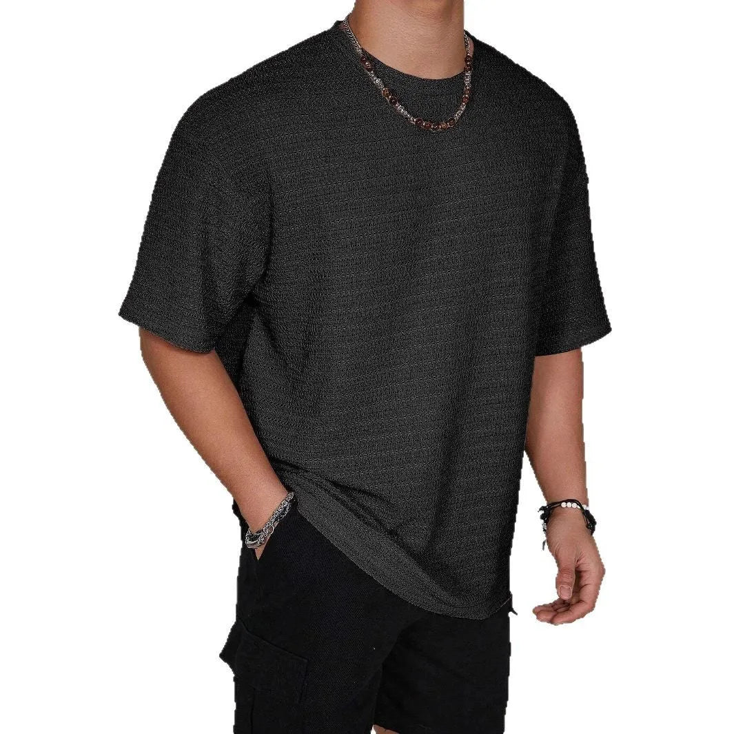 Men's slim fit solid colour short sleeve polyester T-shirt on a hanger.