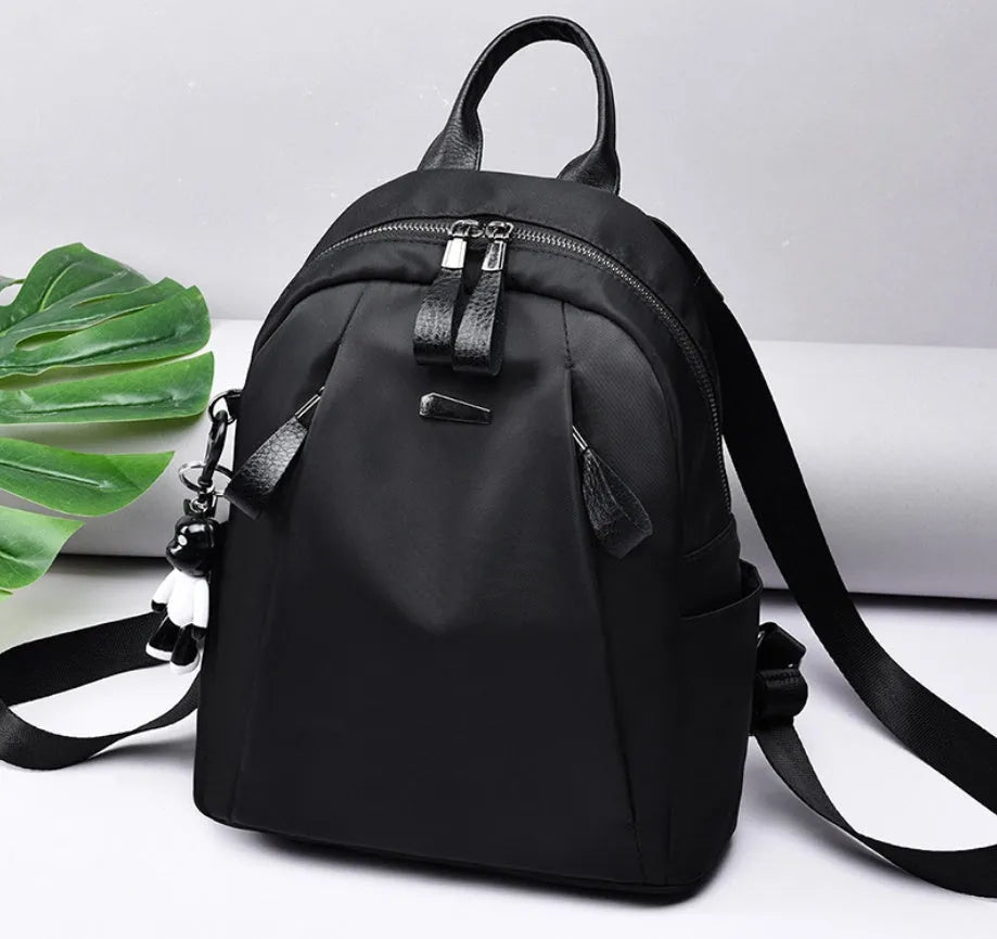 Medium Oxford cloth backpack in grey colour showing interior organisation pockets