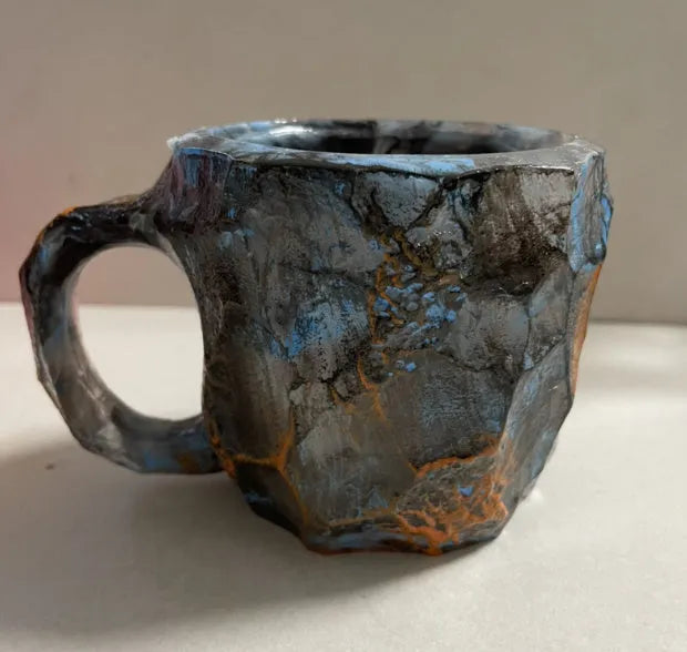 Purple resin mineral crystal coffee mug with handle showing 3D texture and 10cm height