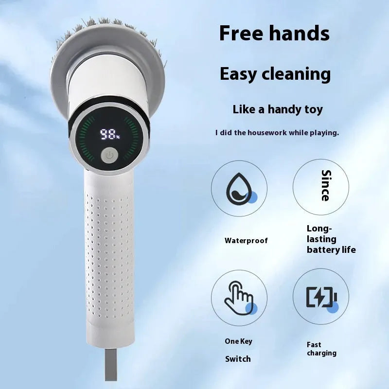White cordless electric cleaning brush with interchangeable heads on a kitchen counter
