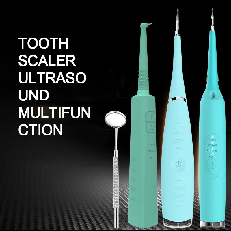 Pink and blue waterproof electric tooth scaler with integrated handle on a bathroom counter.