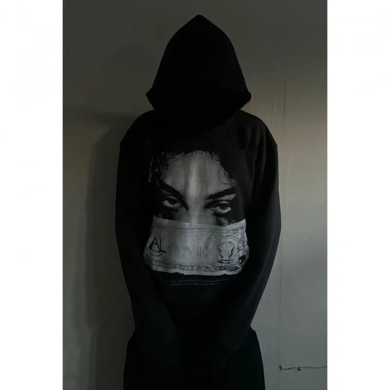 Women's black hoodie with a cartoon pattern print, loose fit.
