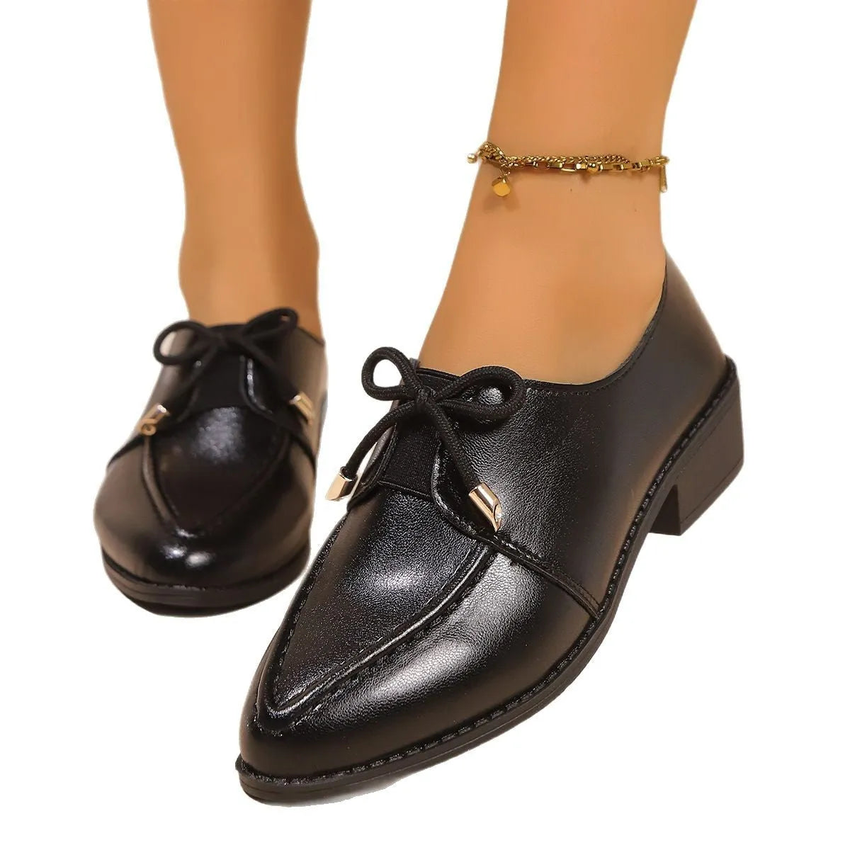 Women's British-style leather shoes with bow decoration, pointed toe, and slip-on design
