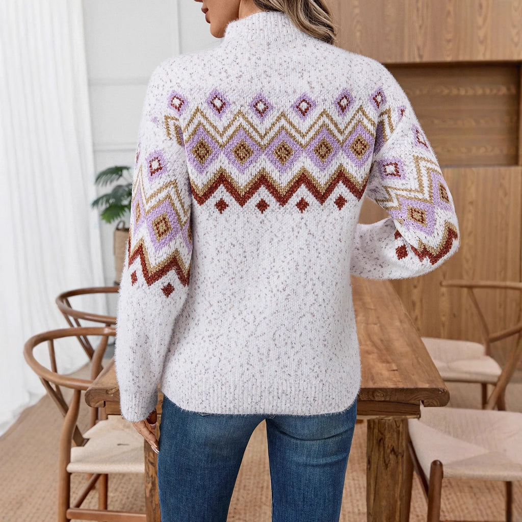 White loose-fit half turtleneck jumper with geometric jacquard pattern and long sleeves.