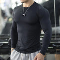 Men's black fitness tights with long sleeves slim fit design for athletic activities