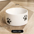 Ceramic cat paw design pet bowl with high-foot base in slanted mouth style