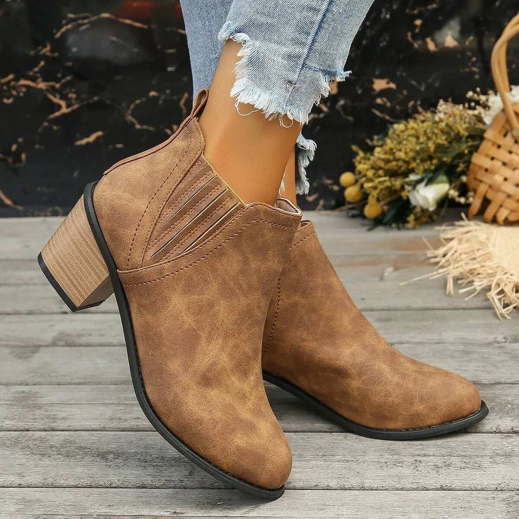 Women's black pointed toe ankle boots with thick square heel slip-on design
