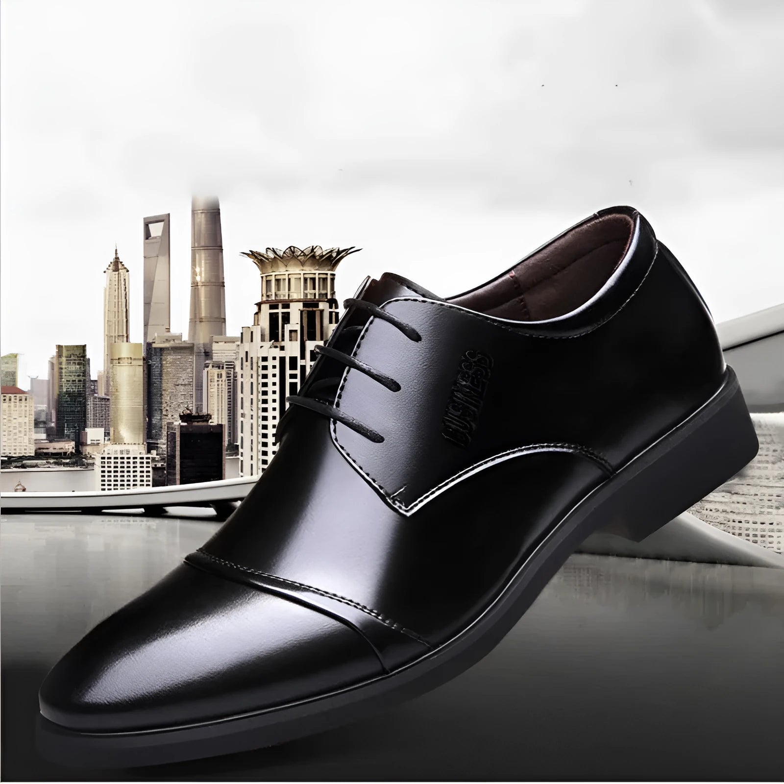 Men's black formal lace-up shoes with stitching detail on a rubber sole